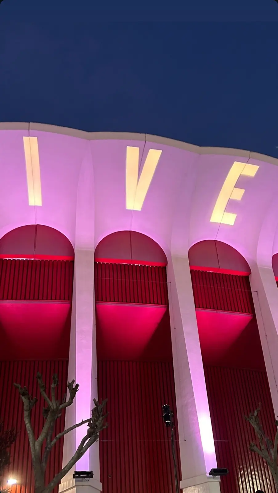 Kia Forum illuminated for an IVE concert